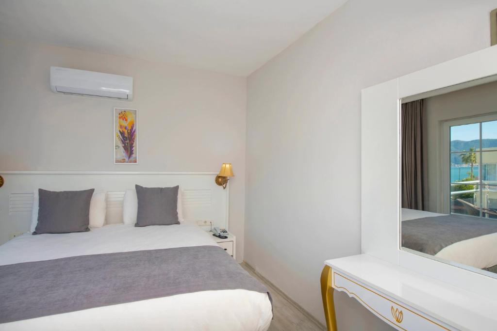 Postel nebo postele na pokoji v ubytování Mia Casa Hotel