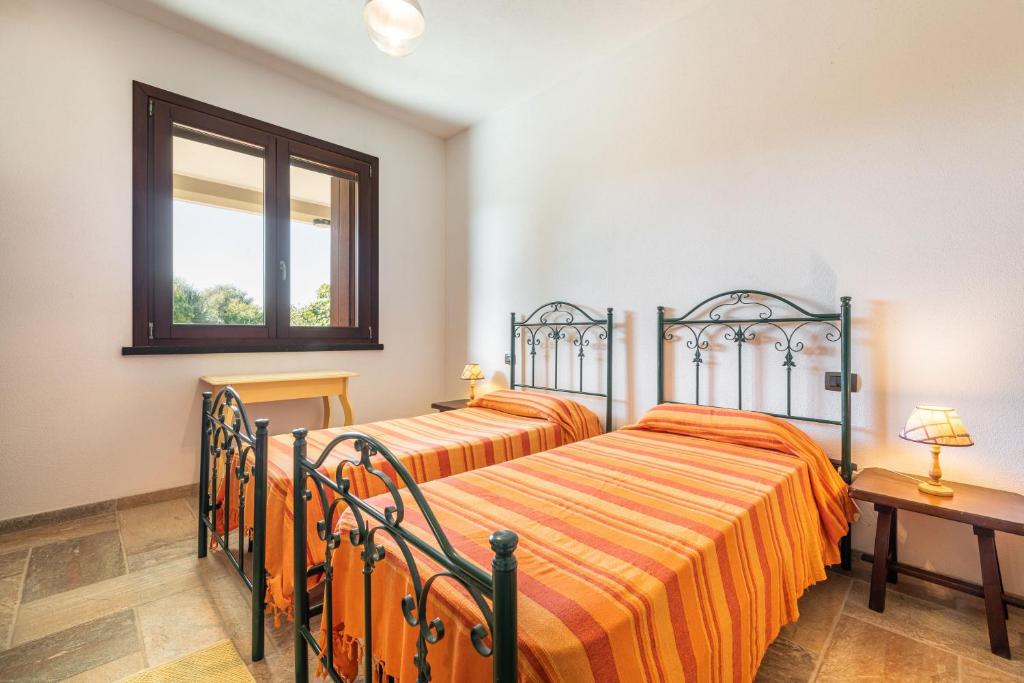 Łóżko lub łóżka w pokoju w obiekcie Villa Fico