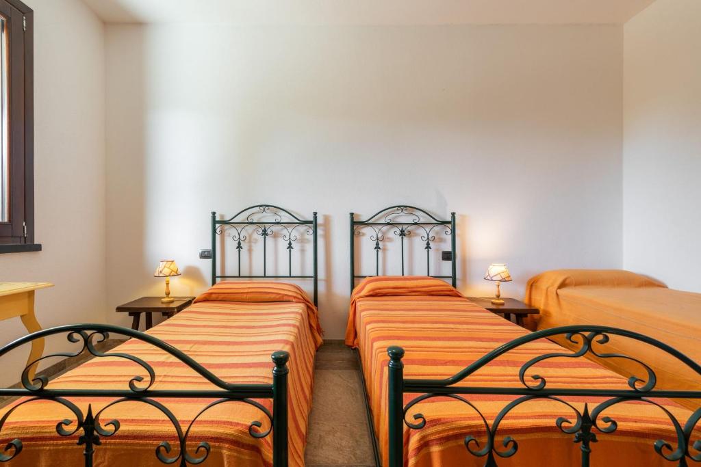 Łóżko lub łóżka w pokoju w obiekcie Villa Fico