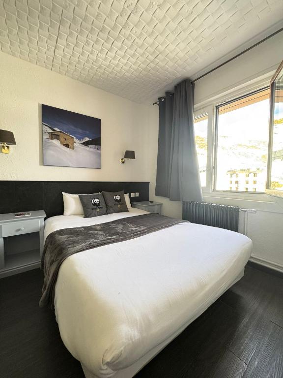 Postel nebo postele na pokoji v ubytování Hotel Panda
