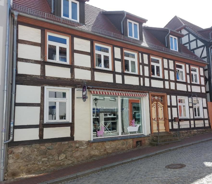 a half timbered building on the side of a street at FeWo Lina in Waren
