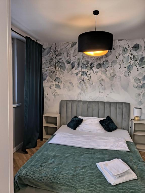 Posteľ alebo postele v izbe v ubytovaní Tabago Studio 4 Katowice Superjednostka