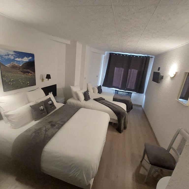 Postel nebo postele na pokoji v ubytování Hotel Panda