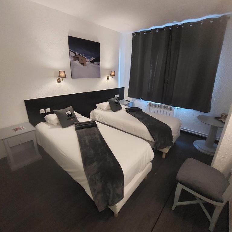Postel nebo postele na pokoji v ubytování Hotel Panda