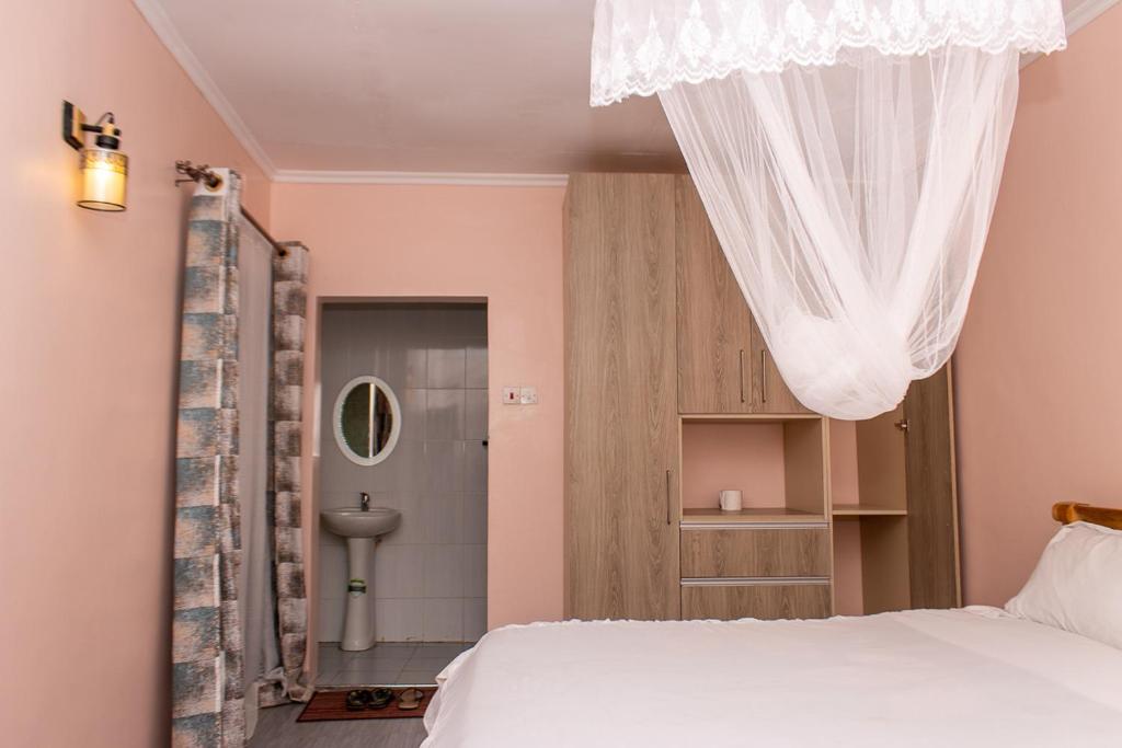 Postel nebo postele na pokoji v ubytování CRYSTAL HOMES By CHEMA