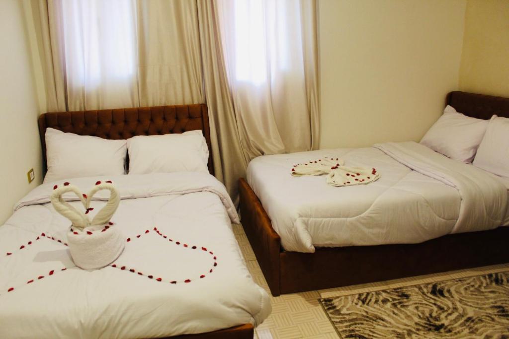 Postel nebo postele na pokoji v ubytování King hur pyramids inn