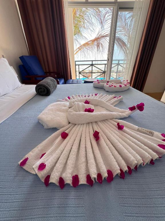 Postel nebo postele na pokoji v ubytování Mia Boutique Hotel