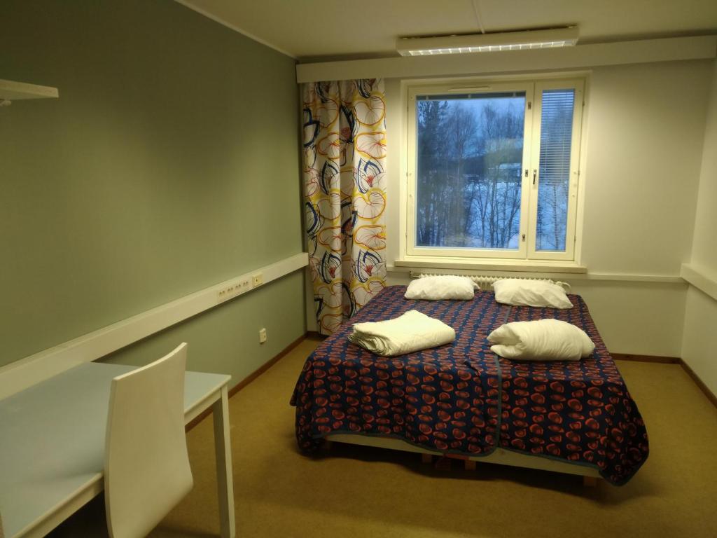 Postel nebo postele na pokoji v ubytování Grand Hostel Ivalo