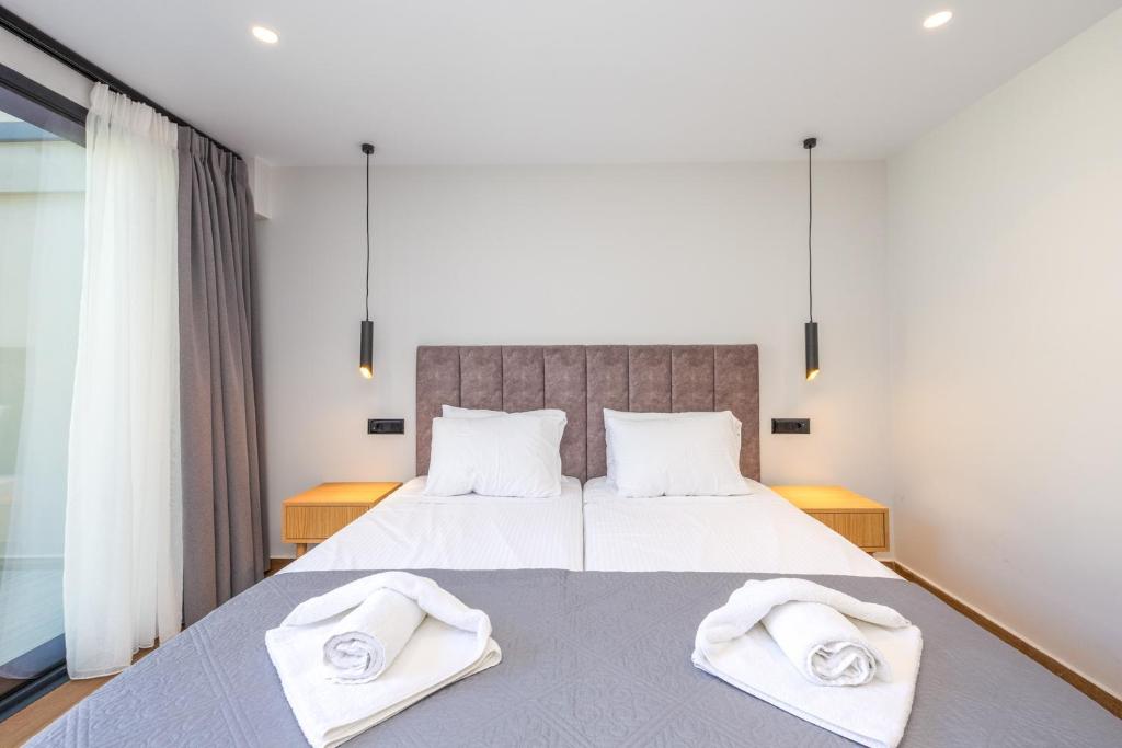 Postel nebo postele na pokoji v ubytování Nobile Hotel