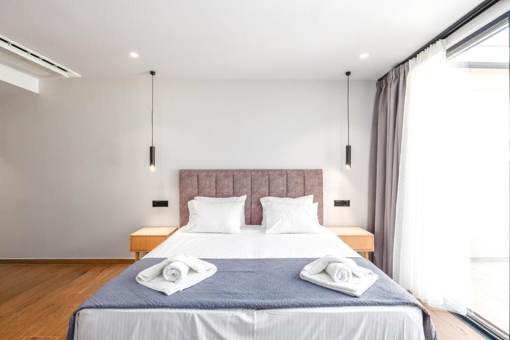 Postel nebo postele na pokoji v ubytování Nobile Hotel
