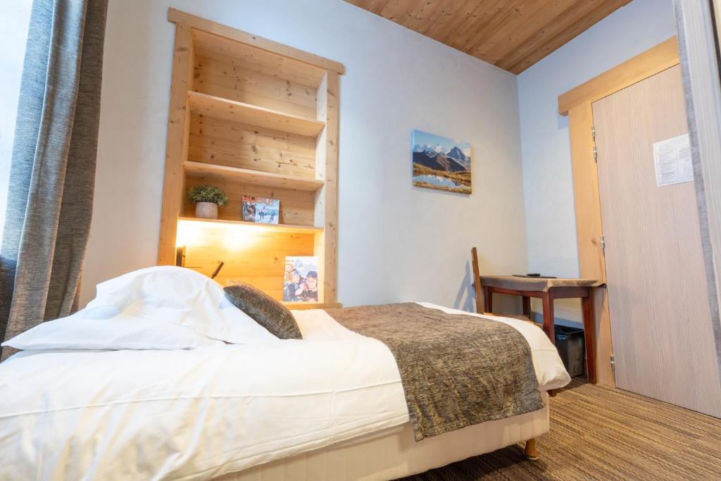 Postel nebo postele na pokoji v ubytování Hotel la Pointe Percee