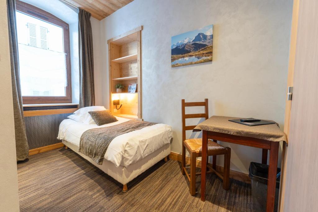 Postel nebo postele na pokoji v ubytování Hotel la Pointe Percee