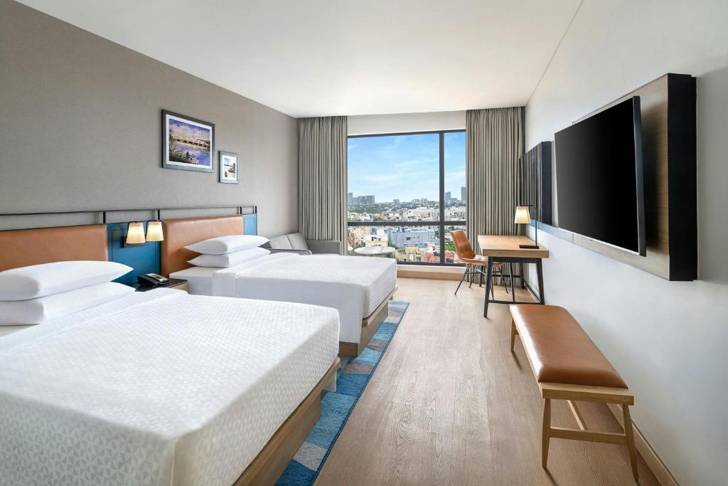 Postel nebo postele na pokoji v ubytování Four Points by Sheraton Chennai, Velachery