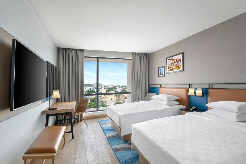 Postel nebo postele na pokoji v ubytování Four Points by Sheraton Chennai, Velachery