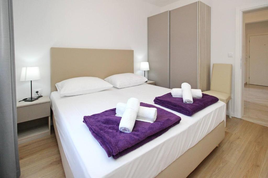 Postel nebo postele na pokoji v ubytování Sunshine Residence Baska