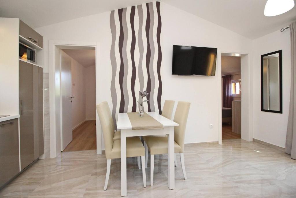 TV a/nebo společenská místnost v ubytování Sunshine Residence Baska