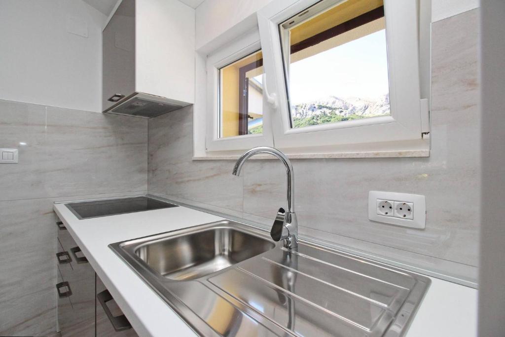 Kuchyň nebo kuchyňský kout v ubytování Sunshine Residence Baska