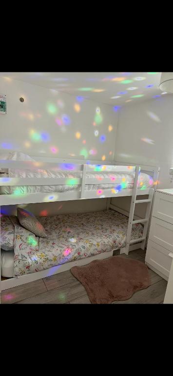 a white bunk bed in a room with a ceiling at Chic Chalets in Sheerness
