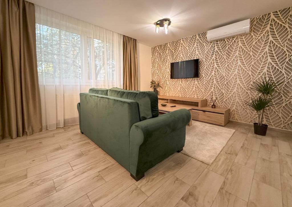 TV a/nebo společenská místnost v ubytování Viola Apartman
