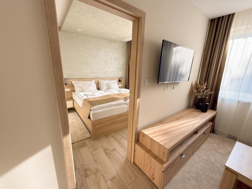 Postel nebo postele na pokoji v ubytování Viola Apartman