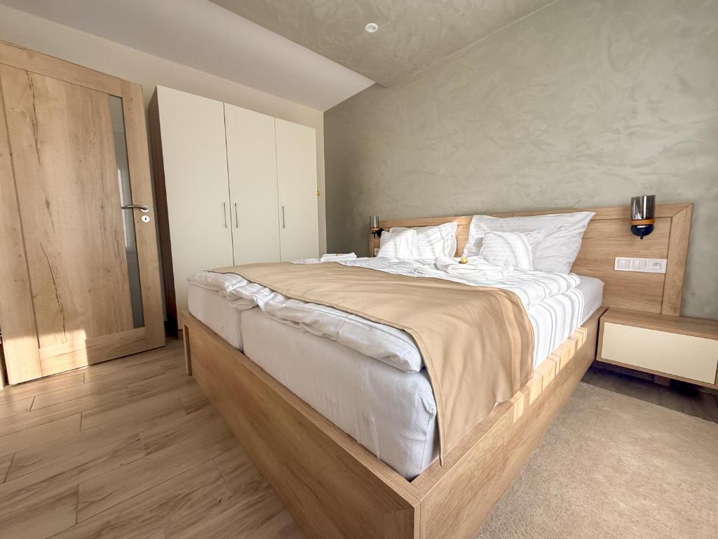 Postel nebo postele na pokoji v ubytování Viola Apartman
