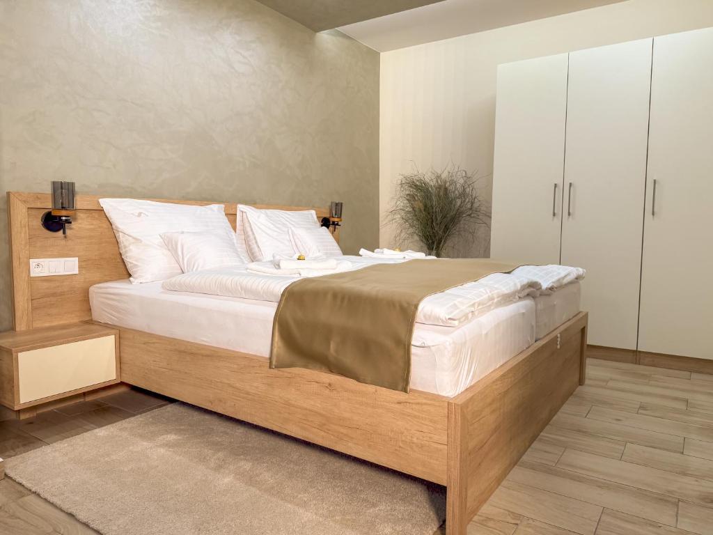 Postel nebo postele na pokoji v ubytování Viola Apartman