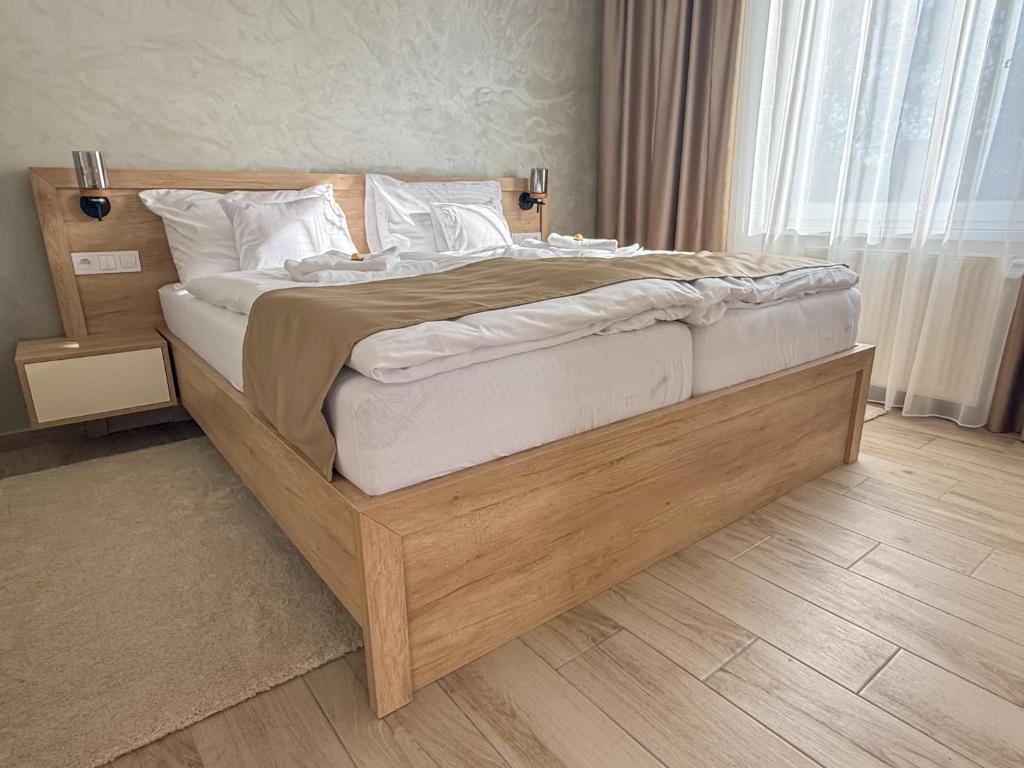 Postel nebo postele na pokoji v ubytování Viola Apartman