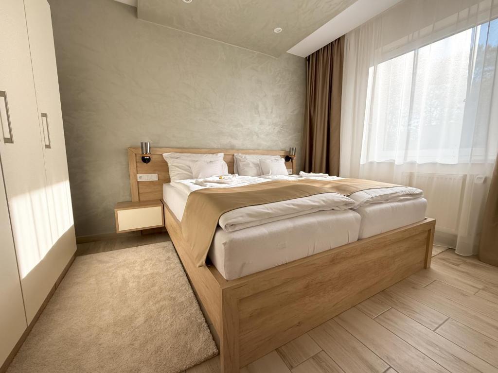 Postel nebo postele na pokoji v ubytování Viola Apartman