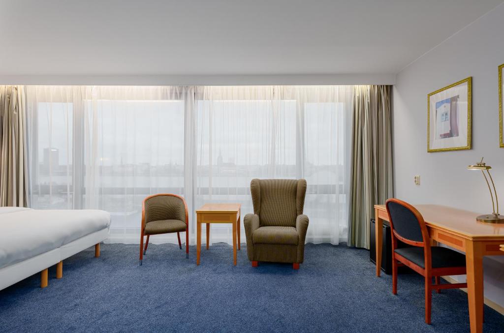 Letto o letti in una camera di Radisson Blu Hotel & Spa, Daugava Riga
