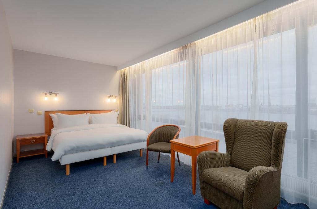 Letto o letti in una camera di Radisson Blu Hotel & Spa, Daugava Riga