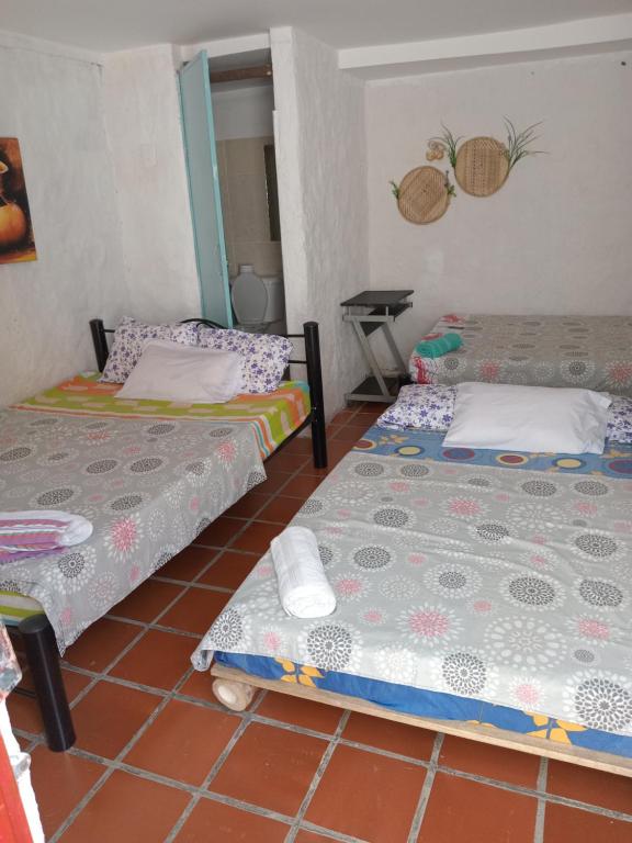 Postel nebo postele na pokoji v ubytování Hostal ROLLED