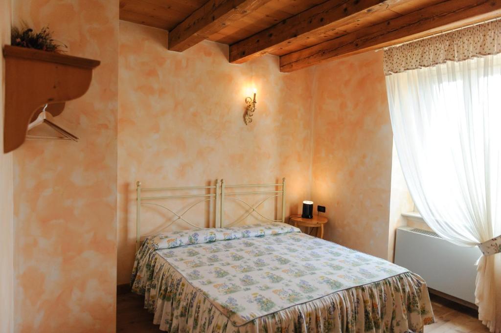 Postel nebo postele na pokoji v ubytování Cascina Le Preseglie