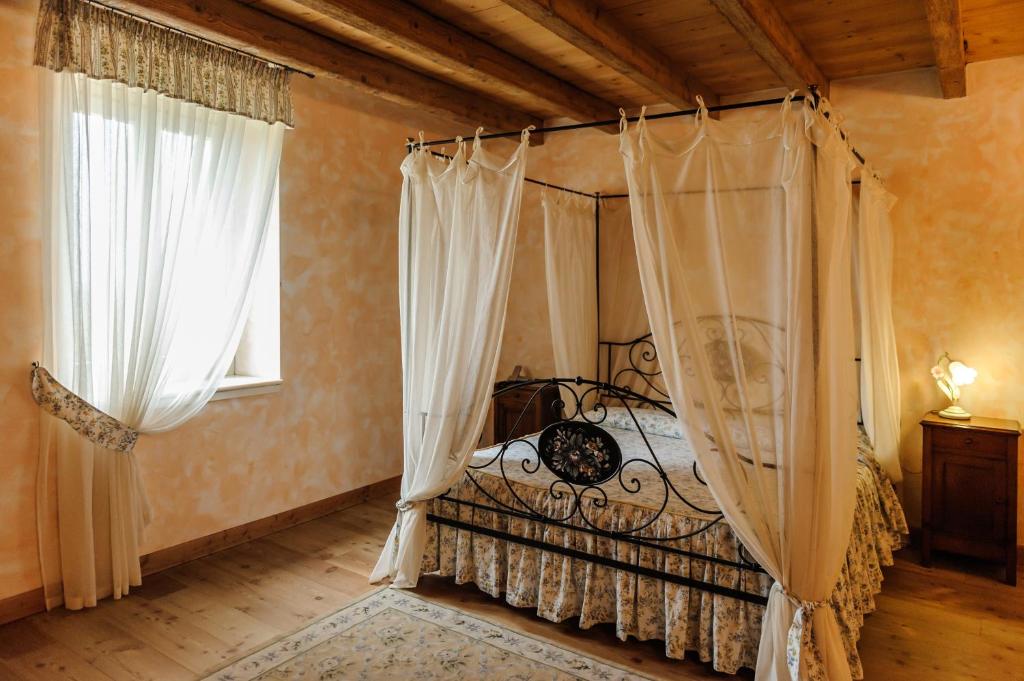 Postel nebo postele na pokoji v ubytování Cascina Le Preseglie
