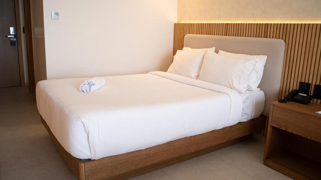 Postel nebo postele na pokoji v ubytování MantaHost Hotel