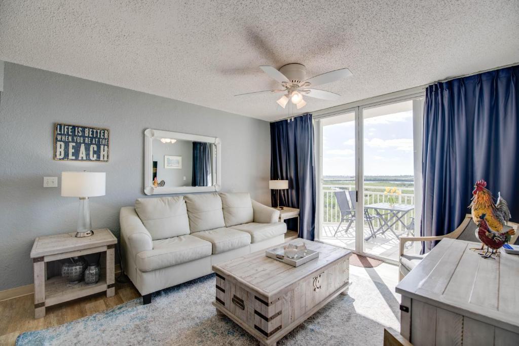 a living room with a couch and a table at The Salt Cay - Sunrise Suites in Key West