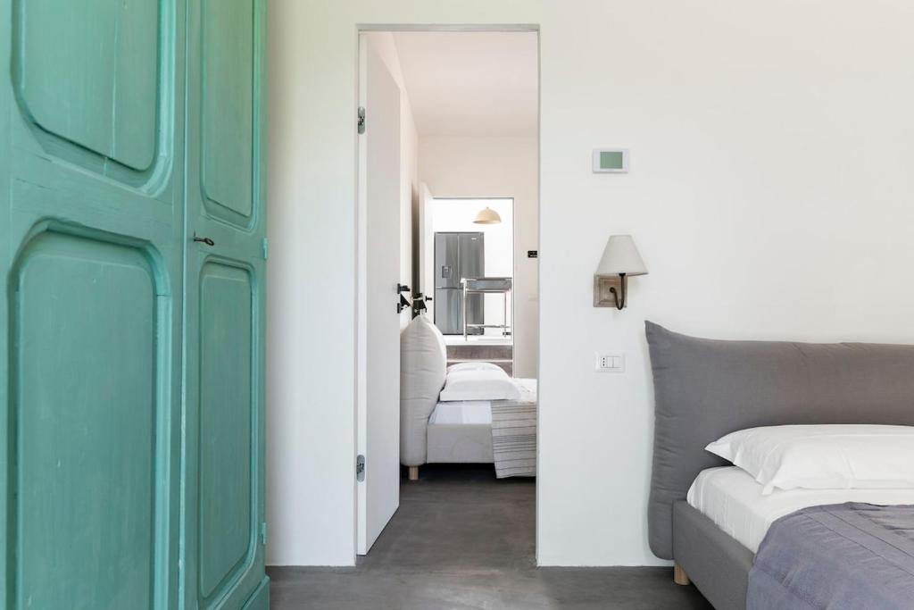 Ένα ή περισσότερα κρεβάτια σε δωμάτιο στο Che Bello Trullo piscina jacuzzi pallavolo