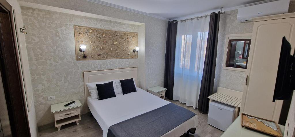 Postel nebo postele na pokoji v ubytování Florian Rooms
