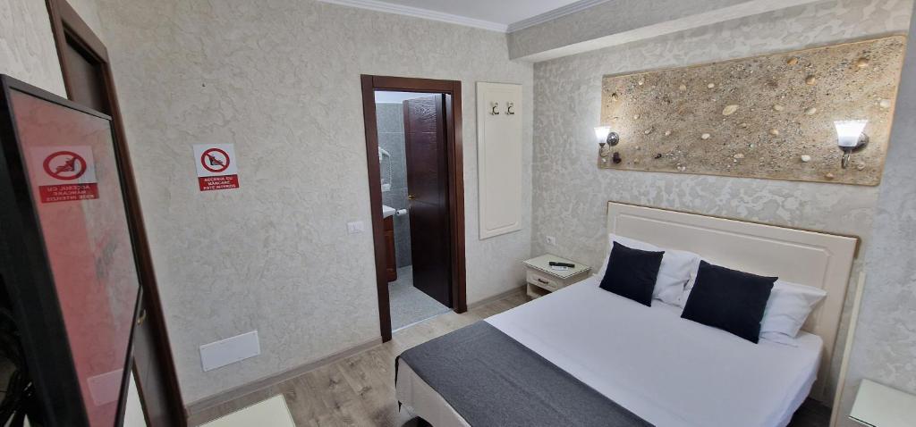 Postel nebo postele na pokoji v ubytování Florian Rooms