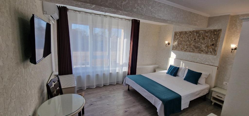 Postel nebo postele na pokoji v ubytování Florian Rooms
