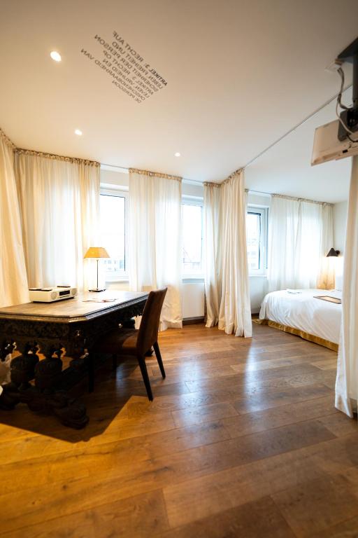Postel nebo postele na pokoji v ubytování Hotel Drei Raben