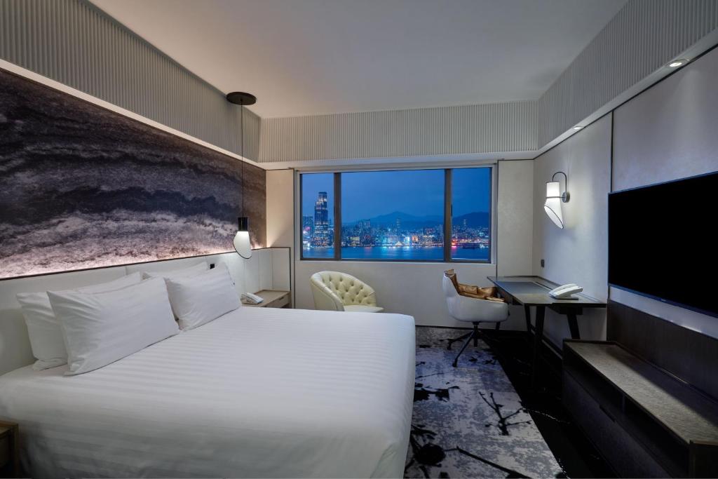 Letto o letti in una camera di The Park Lane Hong Kong, Autograph Collection