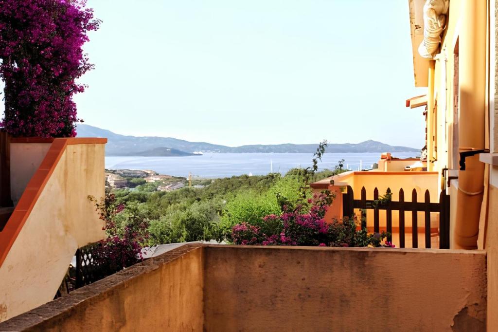 a view from the balcony of a building with flowers at Porto Rotondo Vacanze in Porto Rotondo
