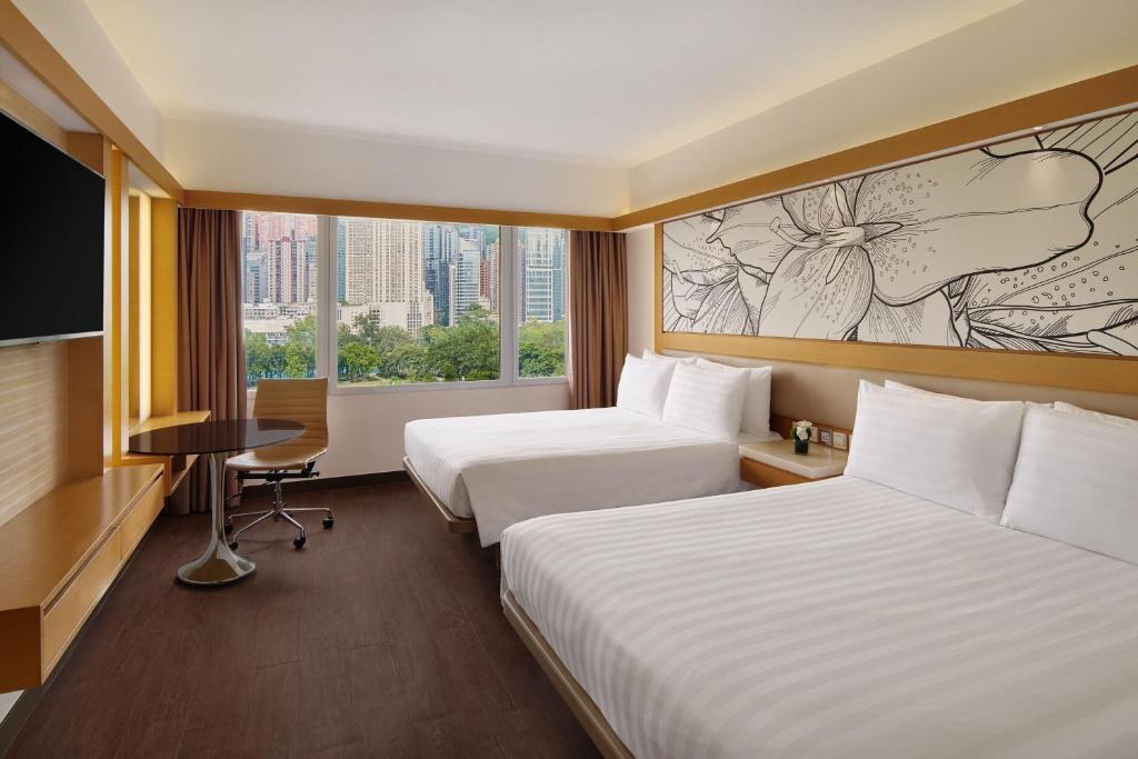 Letto o letti in una camera di The Park Lane Hong Kong, Autograph Collection