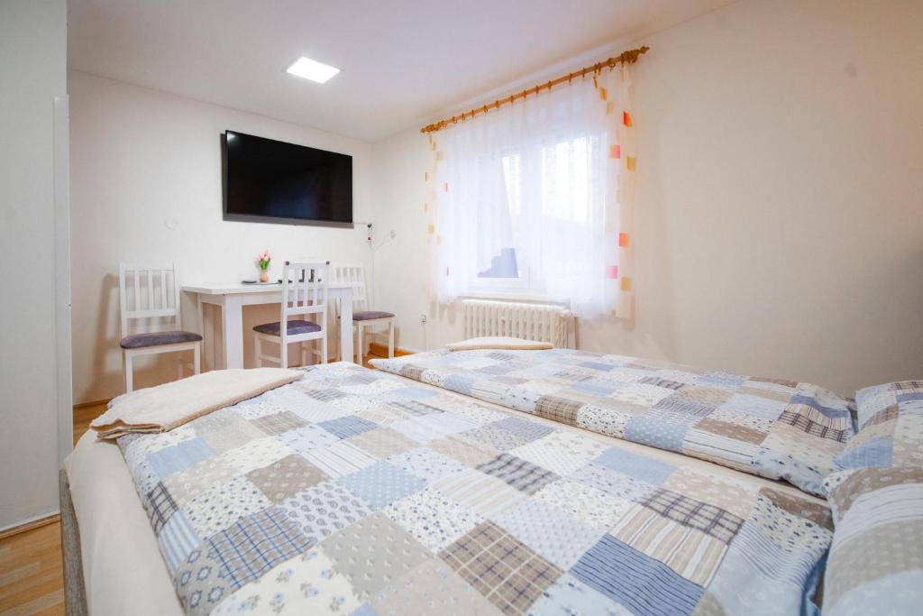 Postel nebo postele na pokoji v ubytování Penzion Mona
