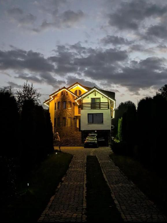 a house with a camper parked in front of it at Casa Letca montain in Sohodol