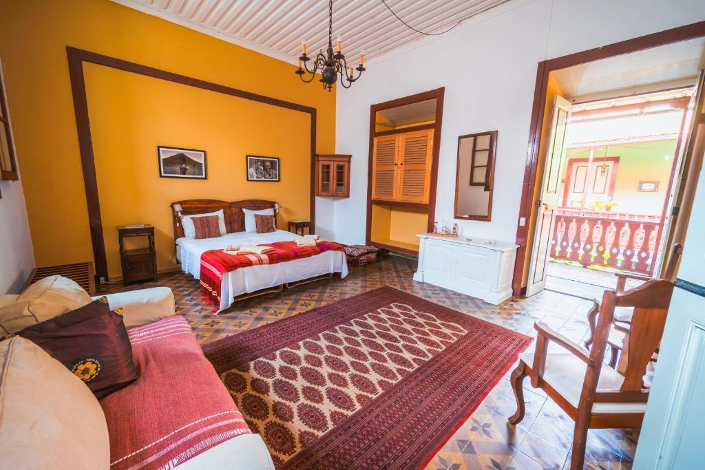Postel nebo postele na pokoji v ubytování The Colonial Guest House