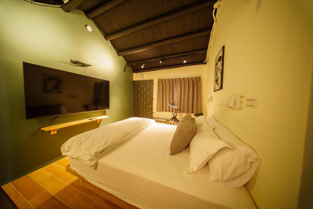 Postel nebo postele na pokoji v ubytování 內之島旅宿 House