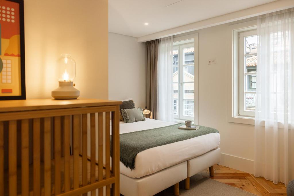 Postel nebo postele na pokoji v ubytování Carvoeiro Boutique Apartments