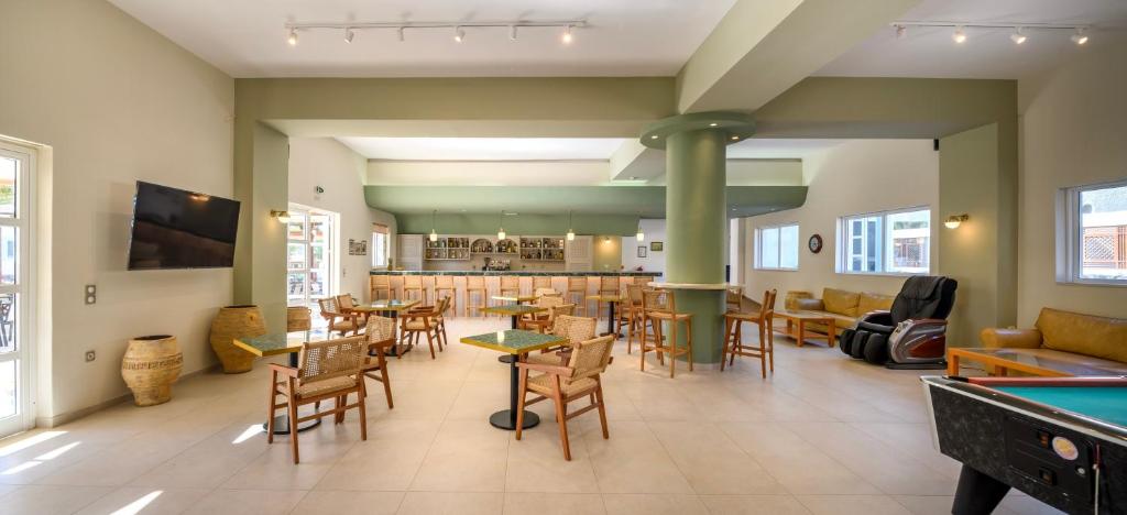 a billiard room with a pool table and a pool table at Kalimera Mare in Kardamaina