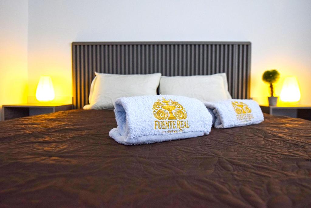 Postel nebo postele na pokoji v ubytování Hotel Fuente Real Popayán